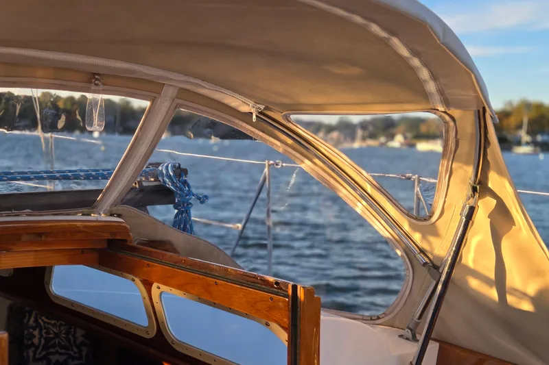 Slide: The Image of 1970 Hinckley Bermuda 40 sailboat cockpit with scenic water view. - 100