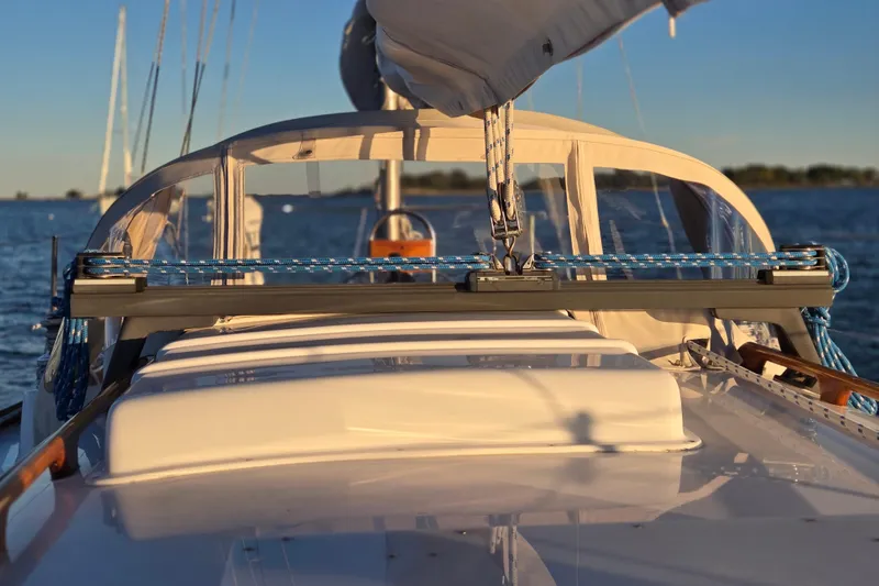 Slide: The Image of 1970 Hinckley Bermuda 40 sailboat deck with ropes and clear sky background. - 103