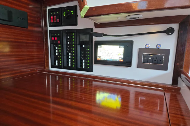 Slide: The Image of Hinckley Bermuda 40 yacht interior with navigation panel and control switches, 1970 model. - 109