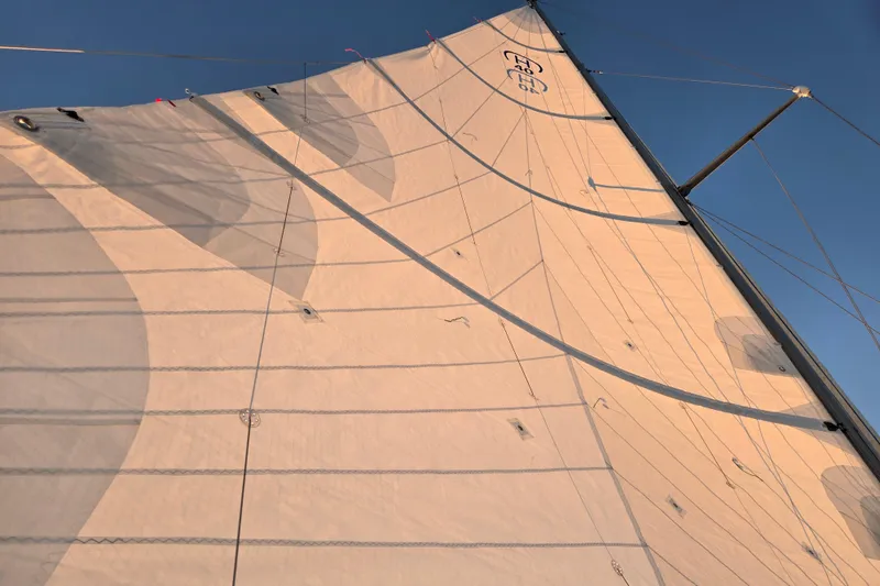 Slide: The Image of Sail of a 1970 Hinckley Bermuda 40 yacht against a clear blue sky. - 118