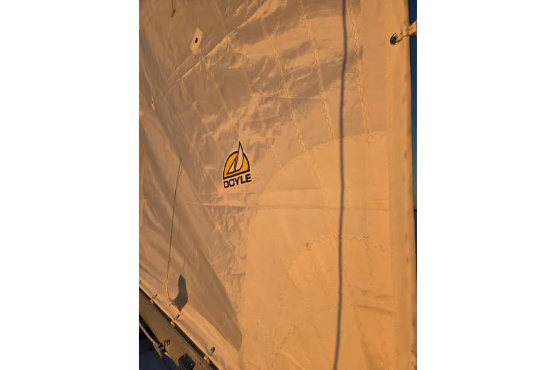 Slide: The Image of Sail of a 1970 Hinckley Bermuda 40 with Doyle logo, sunlit fabric. - 124