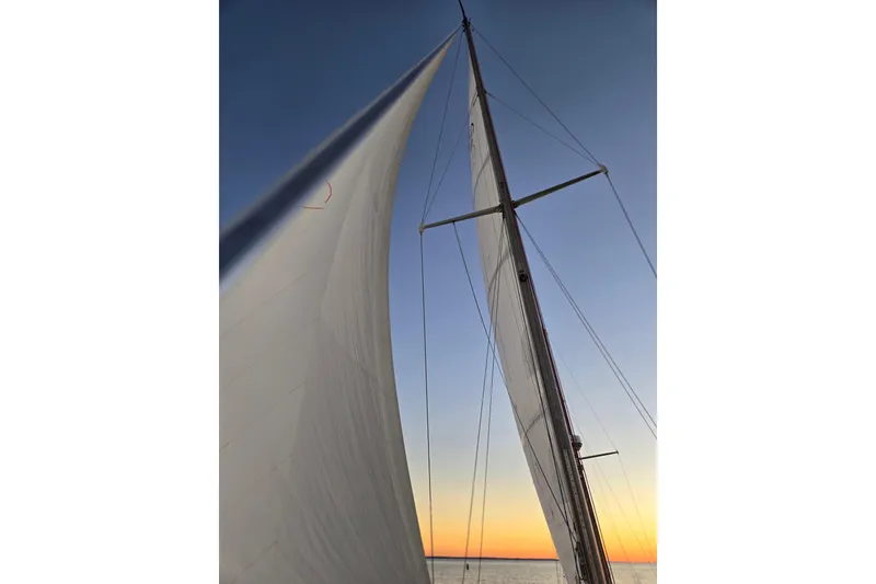 Slide: The Image of Sailing yacht Hinckley Bermuda 40 mast and sails at sunset, 1970 model. - 126
