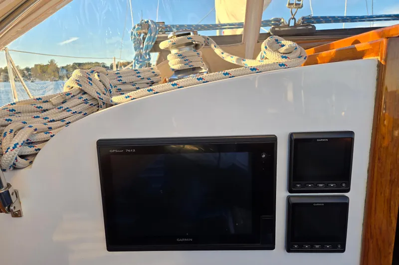 Slide: The Image of Hinckley Bermuda 40 sailboat cockpit with navigation equipment and coiled ropes, 1970 model. - 135