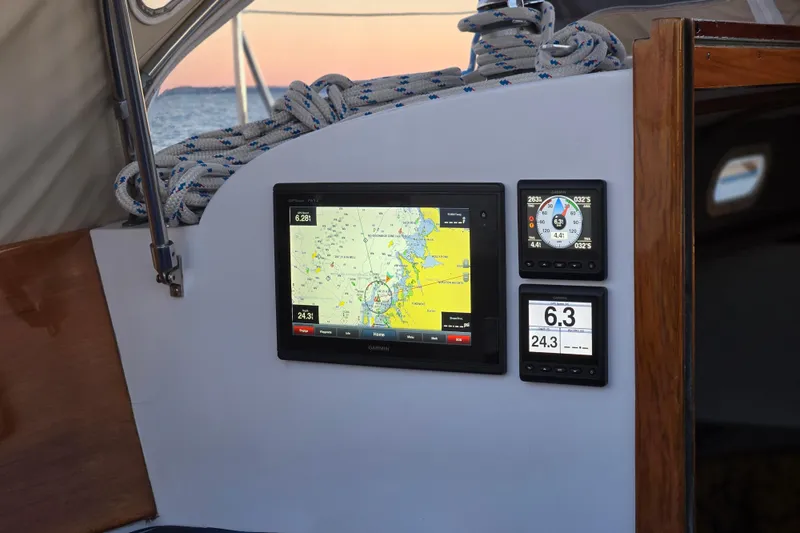 Slide: The Image of Navigation instruments on a 1970 Hinckley Bermuda 40 sailboat, featuring GPS and speed displays. - 137