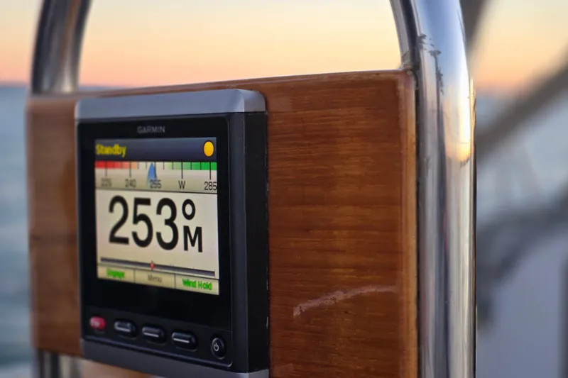 Slide: The Image of Garmin navigation display on 1970 Hinckley Bermuda 40 sailboat at sunset. - 138