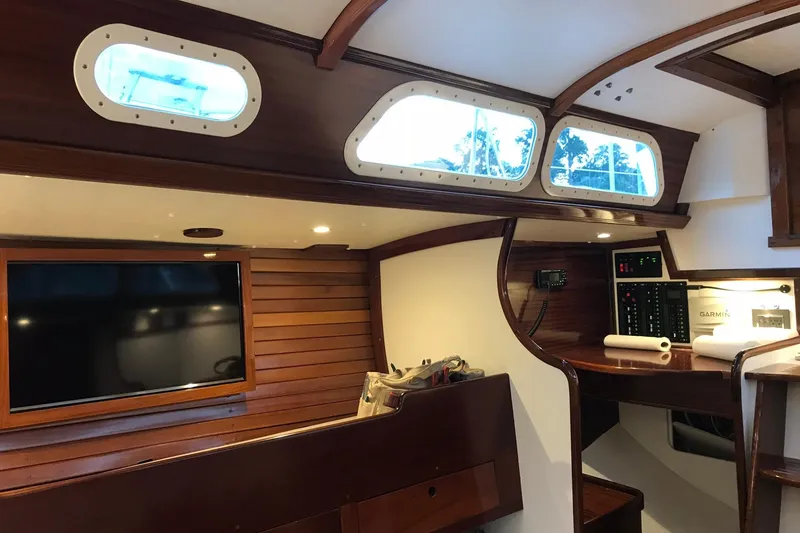 Slide: The Image of Interior of a 1970 Hinckley Bermuda 40 sailboat with wood paneling and navigation equipment. - 14