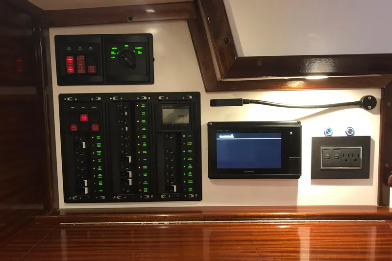 Slide: The Image of Control panel of a 1970 Hinckley Bermuda 40 yacht with modern navigation equipment. - 16