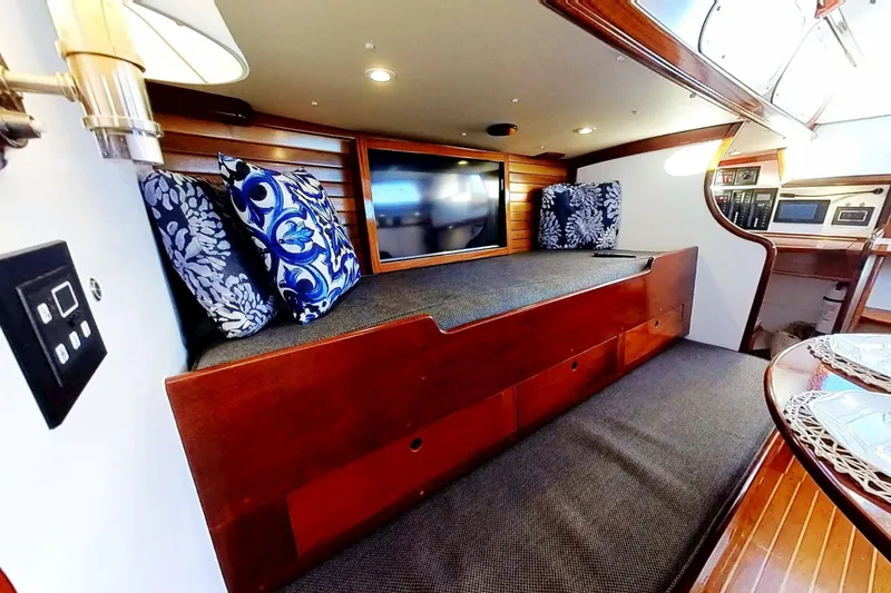 Slide: The Image of Interior of 1970 Hinckley Bermuda 40 yacht with cozy seating and nautical decor. - 160