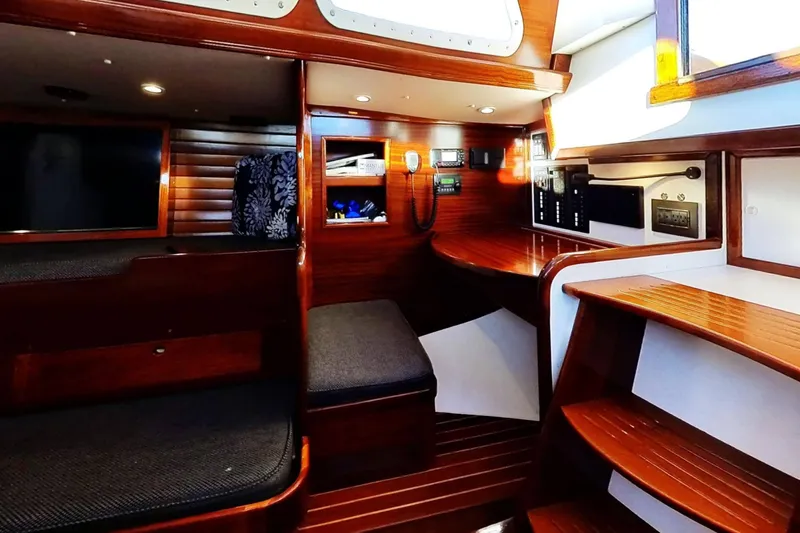 Slide: The Image of Interior of a 1970 Hinckley Bermuda 40 sailboat with polished wood and seating area. - 171
