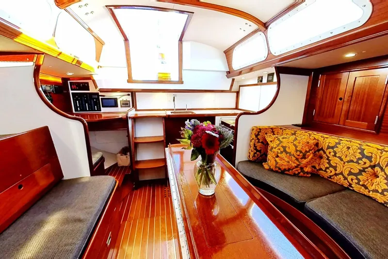 Slide: The Image of Luxurious interior of a 1970 Hinckley Bermuda 40 yacht with elegant wood finishes. - 175