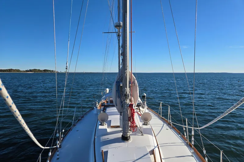 Slide: The Image of Sailing on a 1970 Hinckley Bermuda 40 yacht under clear blue skies. - 30
