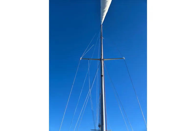Slide: The Image of Mast of a 1970 Hinckley Bermuda 40 sailboat against a clear blue sky. - 31