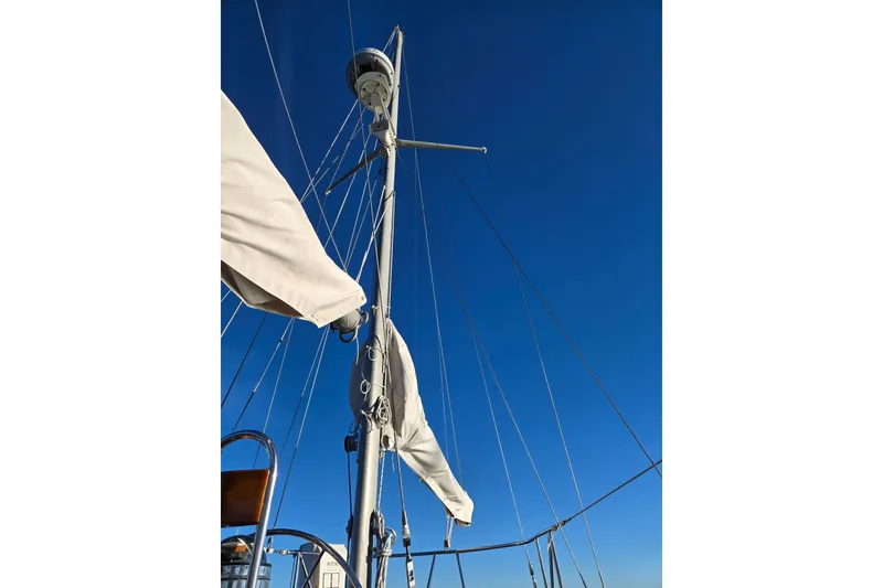 Slide: The Image of Mast and rigging of 1970 Hinckley Bermuda 40 sailboat against clear blue sky. - 32