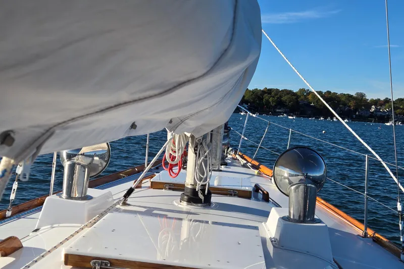 Slide: The Image of 1970 Hinckley Bermuda 40 sailboat deck view on a sunny day at sea. - 40