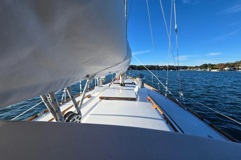 Slide: The Image of Sailing on a 1970 Hinckley Bermuda 40 yacht, blue skies and calm waters. - 41