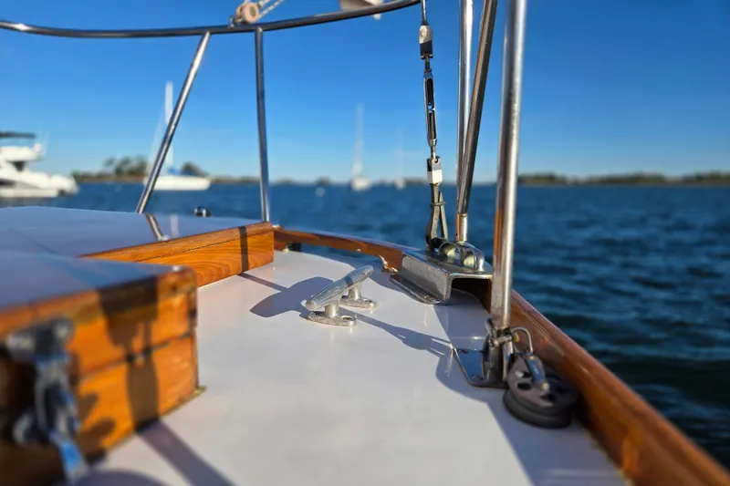 Slide: The Image of 1970 Hinckley Bermuda 40 sailboat deck with ocean view and clear blue sky. - 43