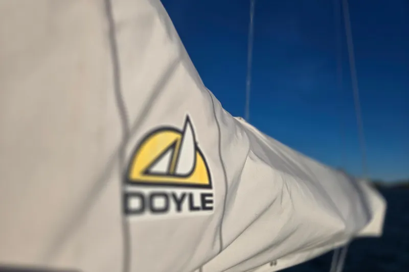 Slide: The Image of Close-up of Doyle sail on 1970 Hinckley Bermuda 40 yacht against clear blue sky. - 45