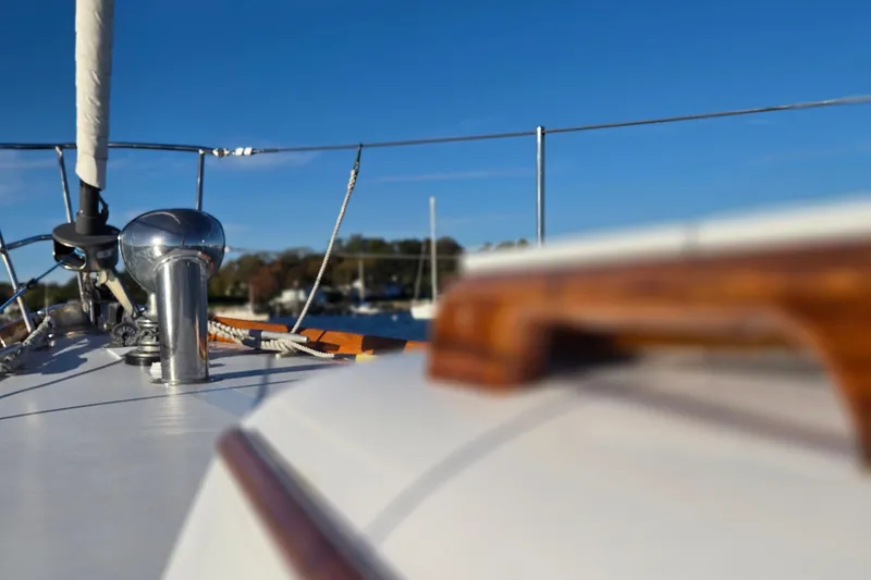 Slide: The Image of Close-up of 1970 Hinckley Bermuda 40 sailboat deck with clear blue sky. - 51