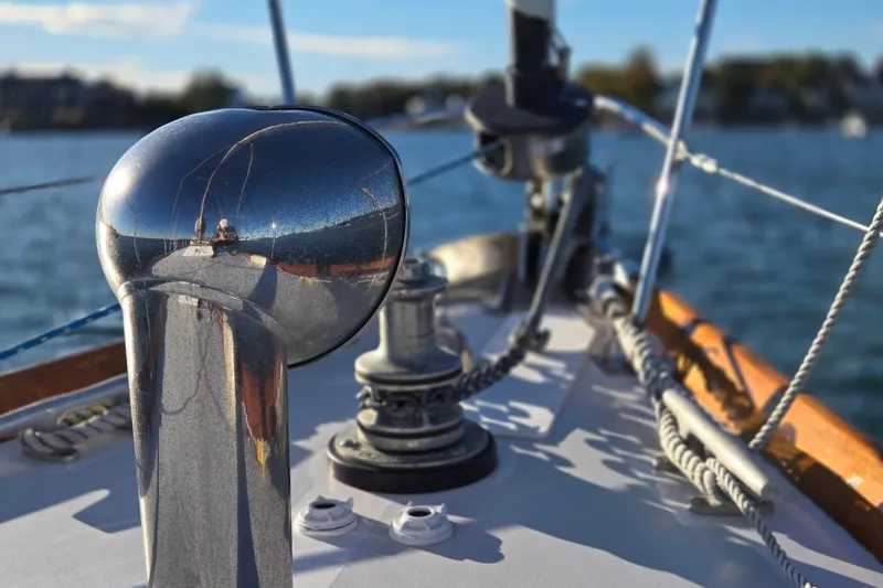 Slide: The Image of Close-up of 1970 Hinckley Bermuda 40 sailboat deck with polished metal fittings. - 54
