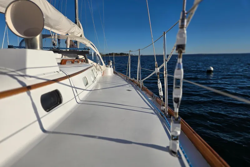 Slide: The Image of 1970 Hinckley Bermuda 40 sailboat deck with ocean view, clear blue sky. - 57