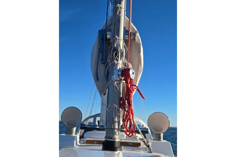 Slide: The Image of Hinckley Bermuda 40 sailboat mast with ropes against clear blue sky, 1970 model. - 59