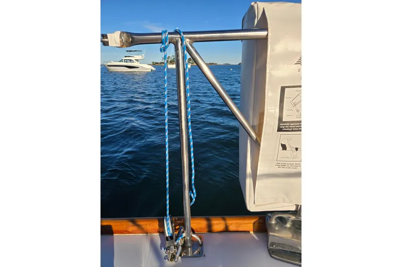Slide: The Image of Hinckley Bermuda 40 sailboat deck with safety equipment and ocean view, 1970 model. - 62