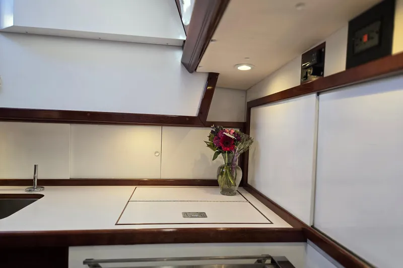 Slide: The Image of Interior of a 1970 Hinckley Bermuda 40 yacht with a vase of flowers. - 71