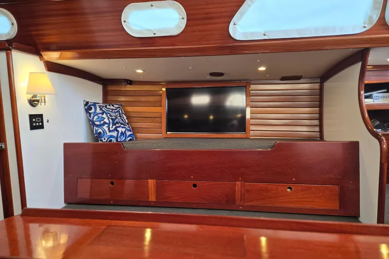 Slide: The Image of Interior of a 1970 Hinckley Bermuda 40 yacht with wooden finish and cozy seating. - 72