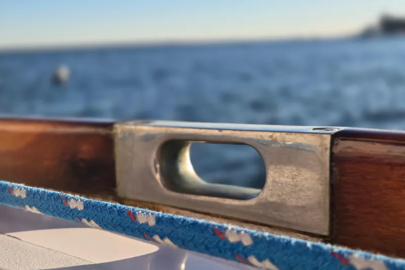 Slide: The Image of Close-up of a Hinckley Bermuda 40 sailboat detail, 1970, with ocean background. - 91