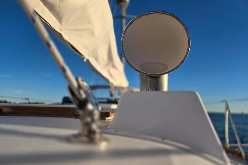 Slide: The Image of Close-up of 1970 Hinckley Bermuda 40 sailboat deck with clear blue sky. - 94