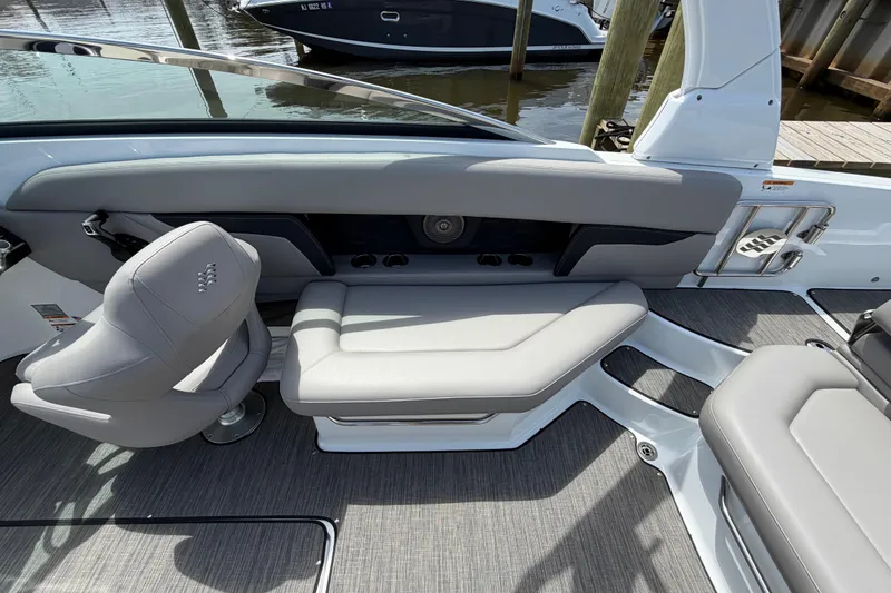 Slide: The Image of 2022 Four Winns HD8 OB boat interior with gray seating and modern design. - 12