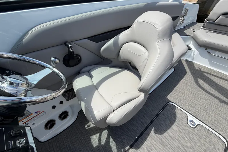 Slide: The Image of 2022 Four Winns HD8 OB boat interior with sleek steering wheel and comfortable seating. - 16