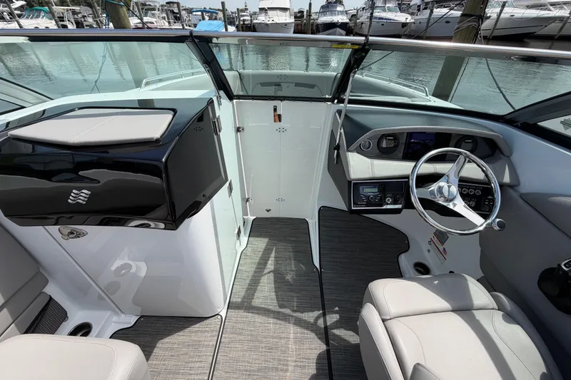Slide: The Image of 2022 Four Winns HD8 OB boat interior with modern dashboard and steering wheel. - 19