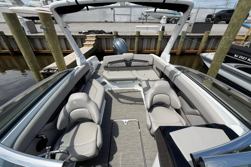 Slide: The Image of 2022 Four Winns HD8 OB boat interior with luxurious seating and modern design. - 22