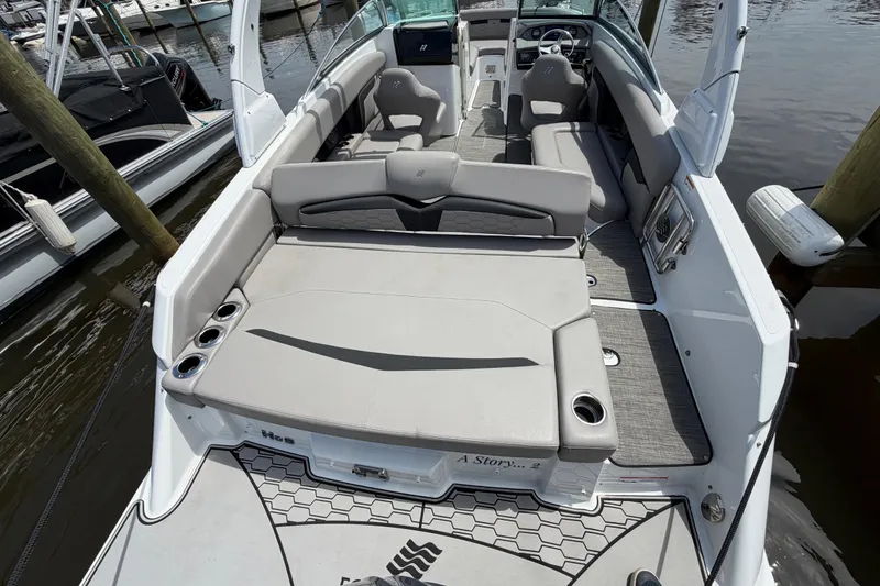 Slide: The Image of 2022 Four Winns HD8 OB boat interior with spacious seating and modern design. - 9