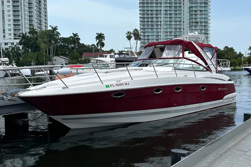 The Image of 2007 Monterey 350 Sport Yacht docked in marina, with cityscape background. - 1