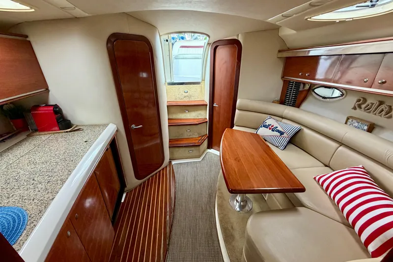 Slide: The Image of Luxurious interior of 2007 Monterey 350 Sport Yacht with elegant wood finishes and cozy seating. - 11