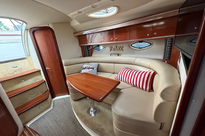 Slide: The Image of Luxurious interior of a 2007 Monterey 350 Sport Yacht with plush seating and elegant wood finishes. - 12