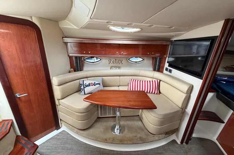 Slide: The Image of Luxurious interior of a 2007 Monterey 350 Sport Yacht with plush seating and elegant wood finishes. - 13