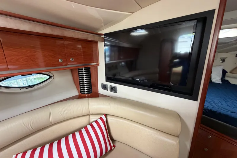 Slide: The Image of Interior of 2007 Monterey 350 Sport Yacht with TV and striped pillow. - 16