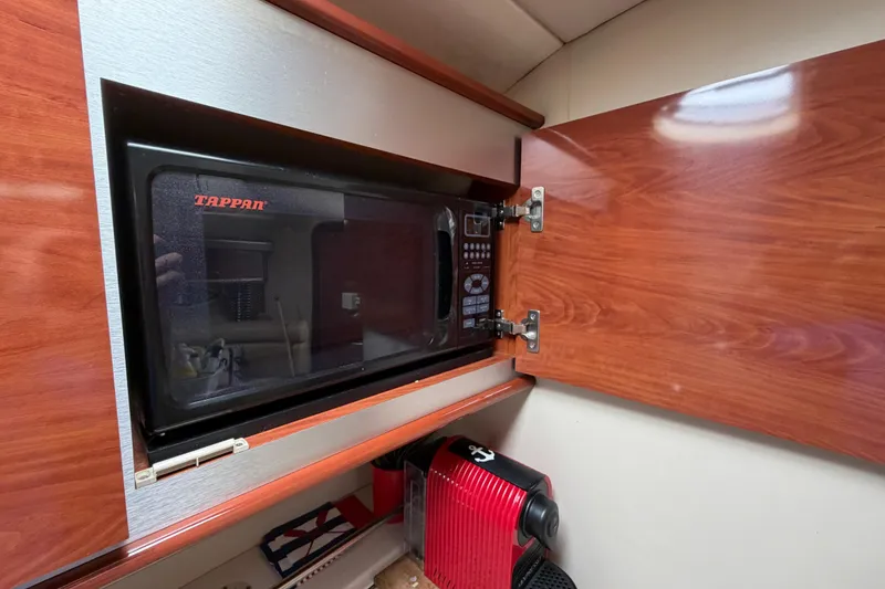 Slide: The Image of Microwave and coffee maker in 2007 Monterey 350 Sport Yacht kitchen cabinet. - 20