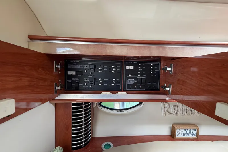 Slide: The Image of Electrical panel inside 2007 Monterey 350 Sport Yacht with wooden cabinetry and nautical decor. - 22