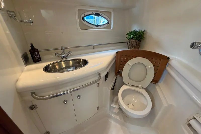 Slide: The Image of Bathroom interior of 2007 Monterey 350 Sport Yacht with sink and toilet. - 28