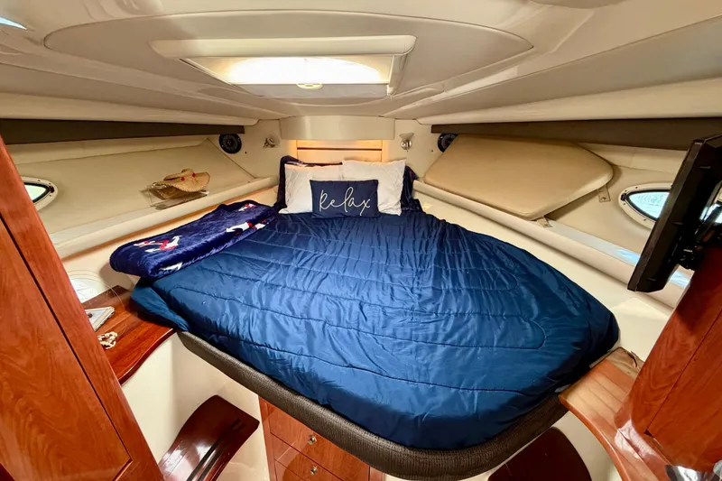 Slide: The Image of Luxurious cabin interior of 2007 Monterey 350 Sport Yacht with cozy bedding. - 29
