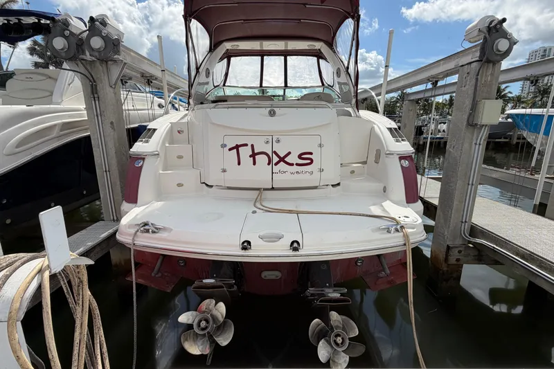 Slide: The Image of 2007 Monterey 350 Sport Yacht docked, rear view with "Thxs for waiting" sign. - 3
