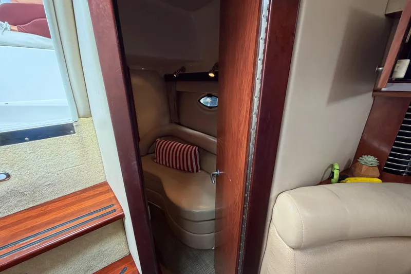 Slide: The Image of Interior cabin of 2007 Monterey 350 Sport Yacht with cozy seating and striped pillow. - 34