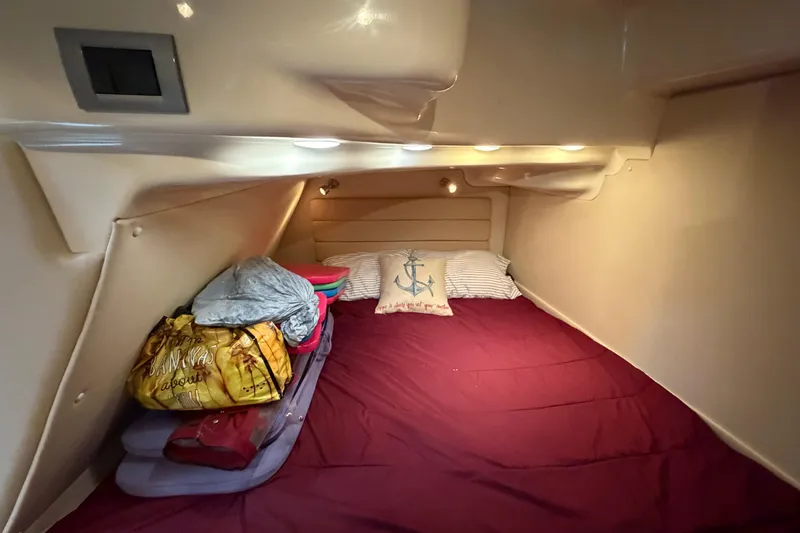 Slide: The Image of Cozy cabin interior of 2007 Monterey 350 Sport Yacht with bedding and ambient lighting. - 37
