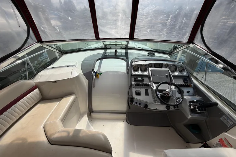 Slide: The Image of 2007 Monterey 350 Sport Yacht cockpit with steering wheel and control panel. - 39