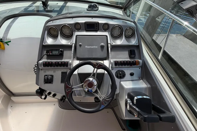 Slide: The Image of Cockpit of 2007 Monterey 350 Sport Yacht with steering wheel and control panel. - 40