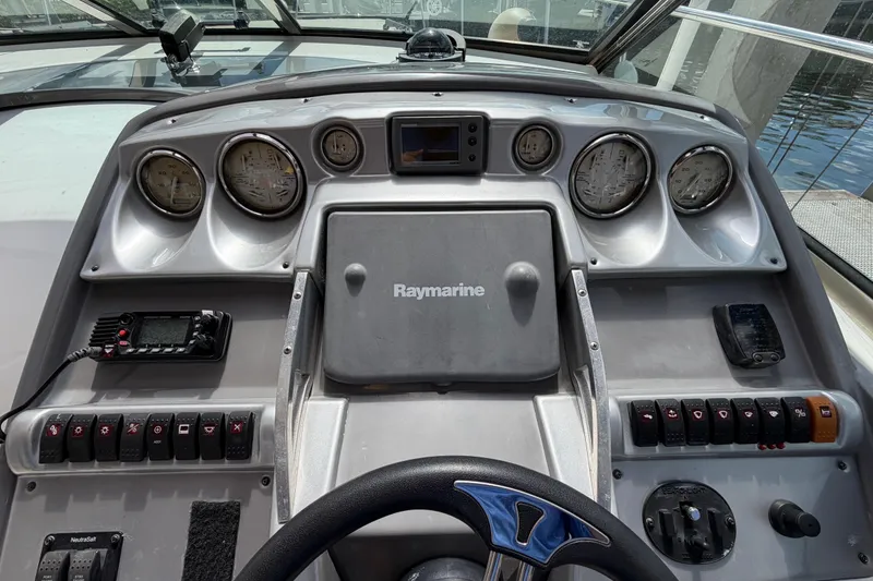 Slide: The Image of Cockpit dashboard of a 2007 Monterey 350 Sport Yacht with gauges and controls. - 41